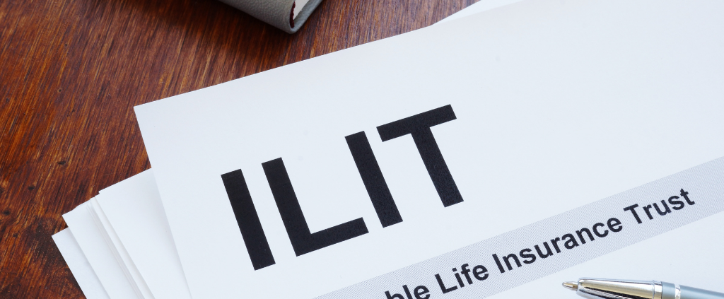 "ILIT: Irrevocable Life Insurance Trust" with a pen resting on top.